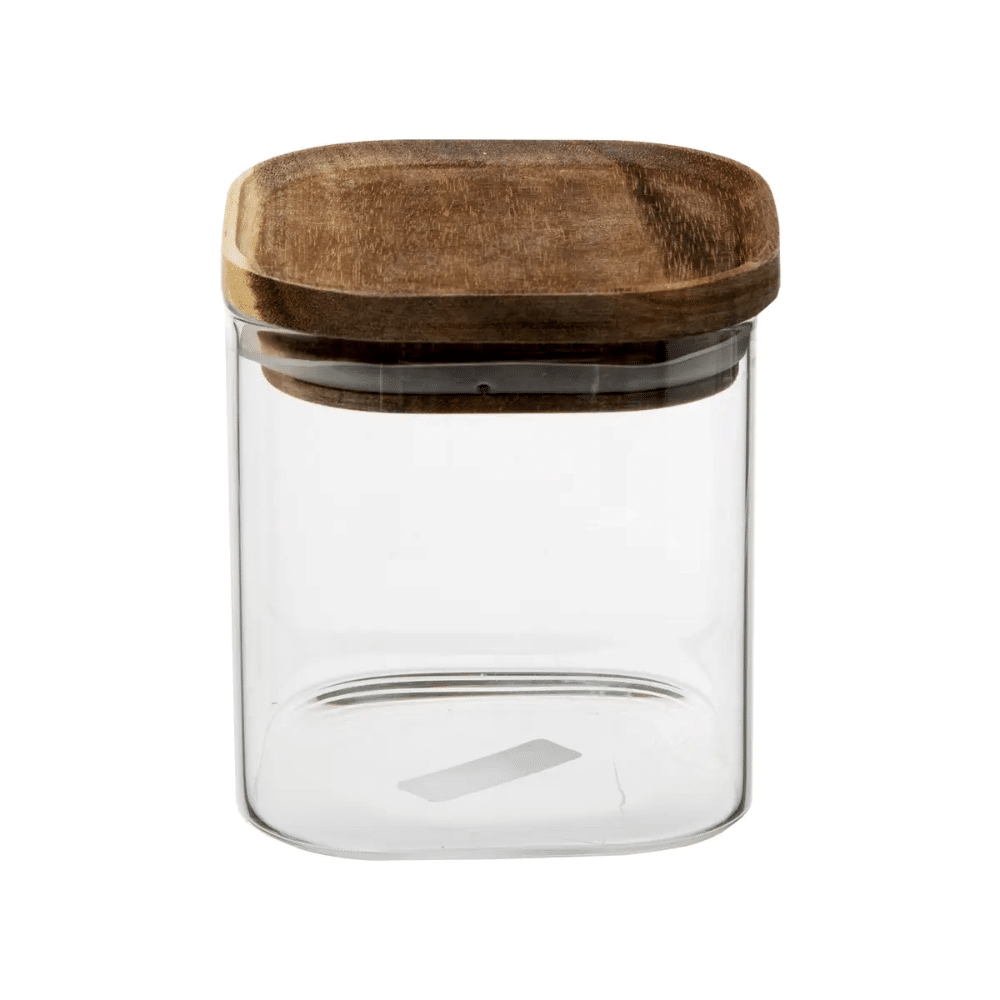 Opbevaringsglas 06 ml | Empty clear glass storage jar with a round wooden lid on a white background.